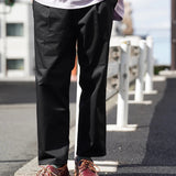 UNIVERSAL OVERALL TUCK TAPERED PANTS