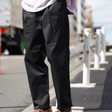 UNIVERSAL OVERALL TUCK TAPERED PANTS