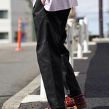 UNIVERSAL OVERALL TUCK TAPERED PANTS
