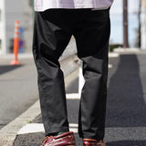 UNIVERSAL OVERALL TUCK TAPERED PANTS
