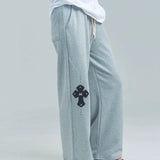 MUCENT/ムセント CROSS LEATHER PATCH SWEAT PANTS